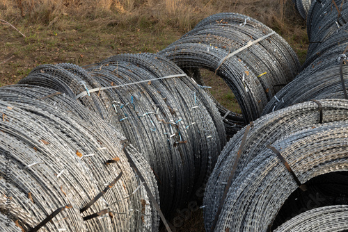 Strategic military defensive supplies: coiled barbed wire for frontline fortifications in Ukraine