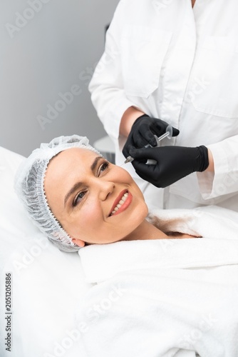 Woman receiving skincare treatment in a modern salon setting