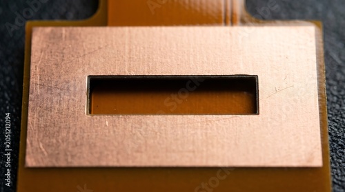Rectangular slot aperture etched in copper ground plane LCP