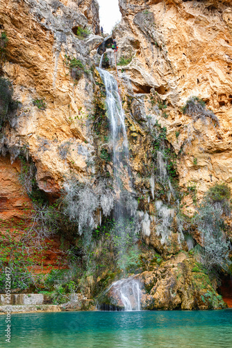 Stunning Rock Formations and Lush Greenery Near a Cliffside in a Serene Natural Setting