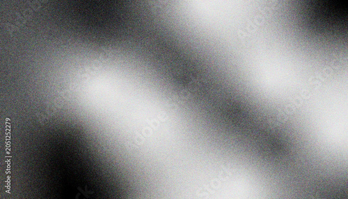 Abstract background with grainy texture and diagonal gradient from dark gray to light gray, representing dynamic movement and subtle light effects.