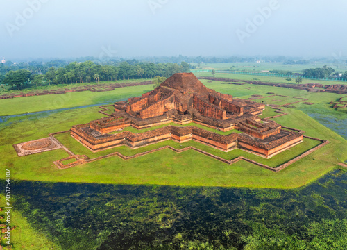 Aerial view of the ancient Buddhist monastery of Sompur Mahavihara with its central cruciform temple structure and green lawns in Naogaon District, Rajshahi Division, Bangladesh.