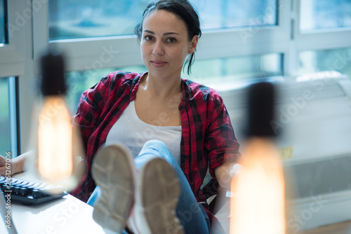 Cuadro en lienzo Confident Creative Professional Sitting with Feet on Desk in Office