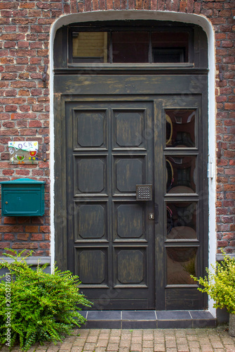 Old wooden house door in German small town, Issum, North-Rhine Westphalia