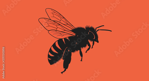 Photos Black silhouette of a bee in flight against a vibrant orange background