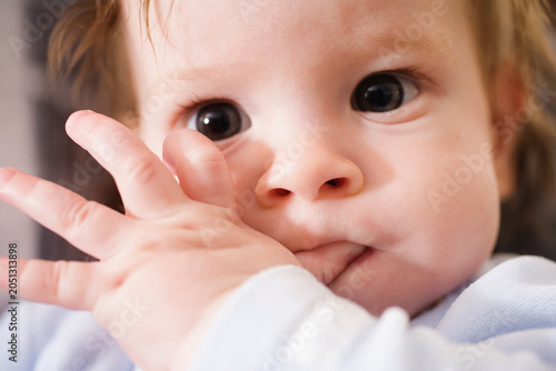 Portrait of a cute child sucking thumb