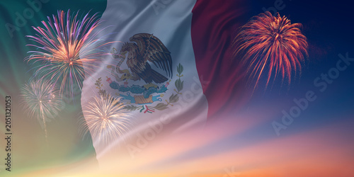 Waving National flags of Mexico In sky with fireworks and text