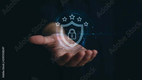 Hand holding digital security shield with lock icon