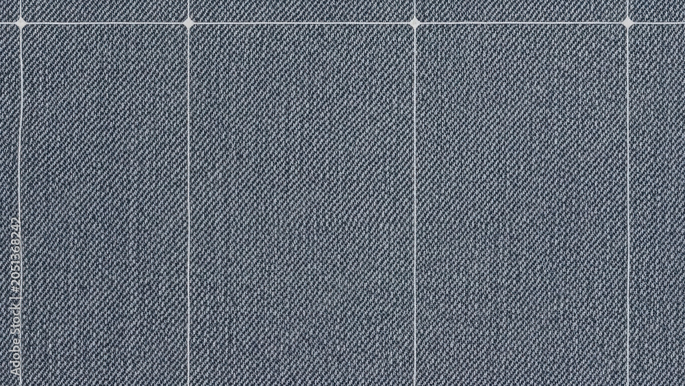 Fototapeta premium A closeup of a blue denim fabric with a visible grid pattern and white stitching lines.