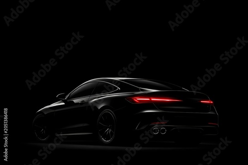 Luxury black car rear view with led lights on a pitch black studio background