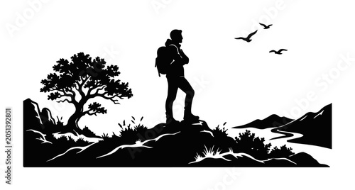 Fotografía Silhouette of a hiker with a backpack standing on a mountain peak overlooking a