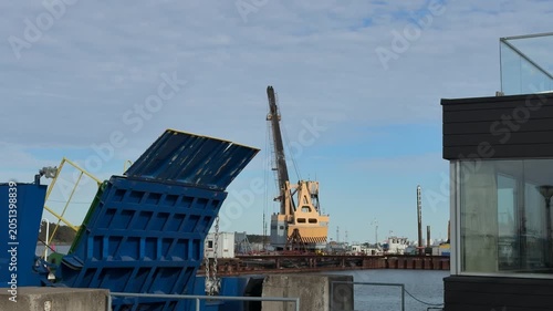 Open ferry ramp and crane in Klaipeda port