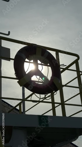 Lifebuoy silhouette on ship deck in Klaipeda harbor