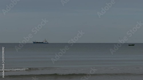 Fishing boats and seabirds on Baltic Sea horizon