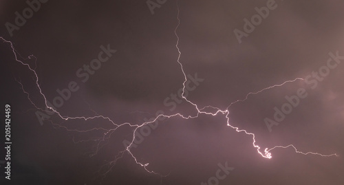 Bilde på lerret Lightning bolt streaking across dark stormy sky