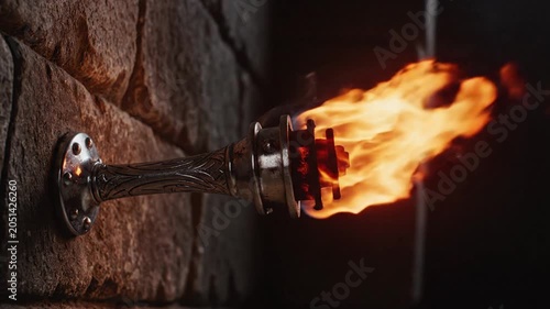 Wall mounted torch, flame lighting, decorative fire, metal holder, stone wall