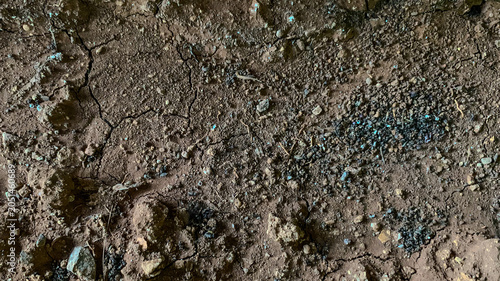 Obraz na plátně Cracked Earth Brown Soil Dark Rocks Texture