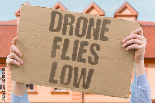 Canvas Print "Drone flies low" UAV operates at dangerous altitude