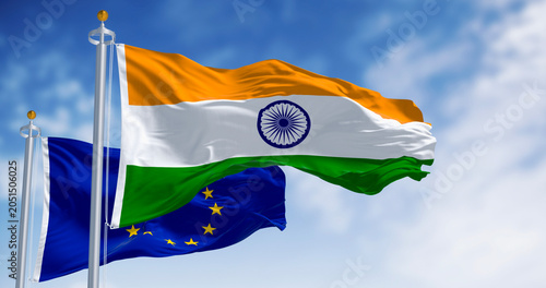 Flags of India and the European Union waving on a clear day