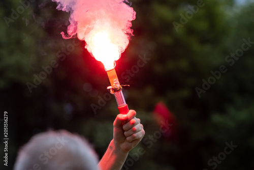 A pyrotechnic device is ignited