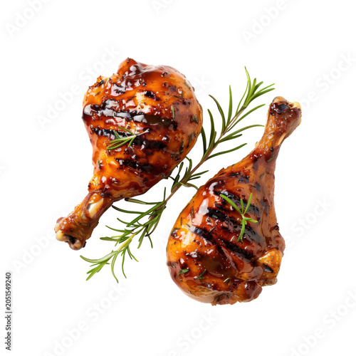 Grilled chicken drumsticks marinated in sweet barbecue sauce with fresh rosemary sprigs.