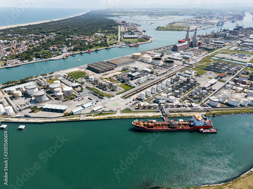 Ravenna, Italy, June 8, 2026: Aerial view of the industrial and port area, featuring storage tanks, power plants, steel manufacturing sites, and logistics infrastructure