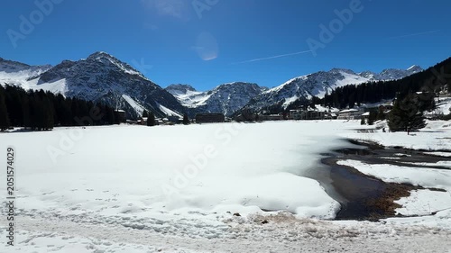 Frozen Lake in Arosa with Snow-Covered Alpine Mountains, Switzerland