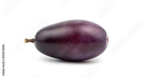 A single dark purple grape isolated on white background