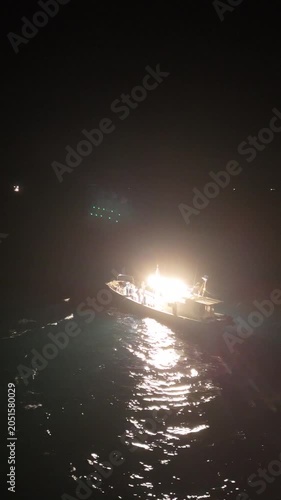 Aerial View of Squid Fishing Boat with Bright Fishing Lights at Night in Hagi Japan, Vertical Marine Landscape 01
