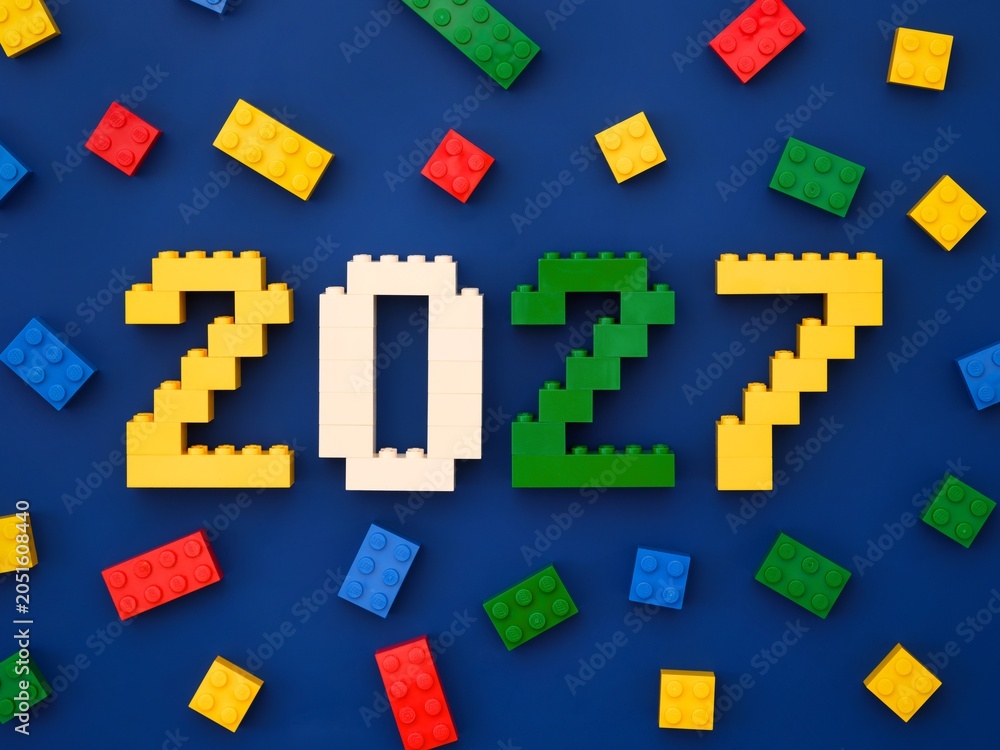 Obraz premium Tambov, Russian Federation - October 13, 2024 Lego numbers 2027 with some Lego bricks on a blue background.