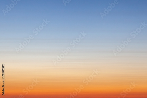 Clear and empty blue and orange gradient sky for background, horizontal image