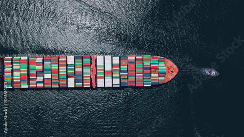Obraz na plátne Container ship freight full of cargo transporting goods for global supply chain