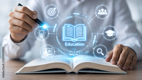 A person writing in a book with a glowing 'education' icon and related learning symbols.