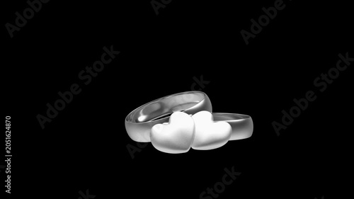 Silver wedding rings with two heart shapes subtly shifting on a black background, 3D render