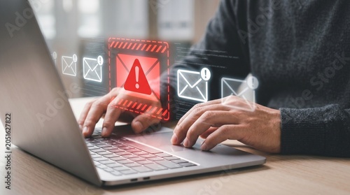 Critical Email Security Alert on laptop screen emphasizes phishing scam and data breach risk for effective online protection strategies.