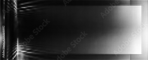 Macro close-up of black ink halftone dots on white paper forming a soft gradient, with a lighter center and denser edges, showing raster pattern and print texture.