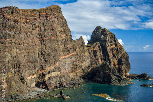 Dramatic layered sea cliffs and rocky pinnacle