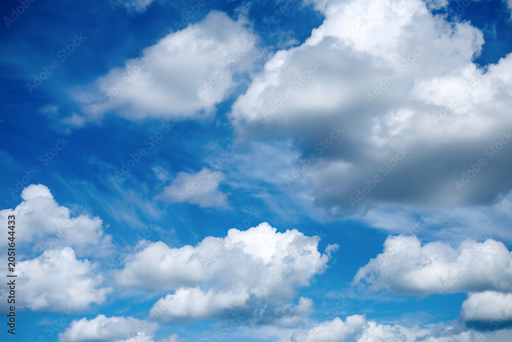 Fototapeta premium White clouds across vivid blue sky, concept of weather background, clean copy space and natural summer atmosphere.