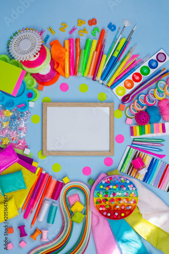 Multicolored craft supplies with copyspace. Craft supplies for creative handmade. Empty picture frame mock up.
