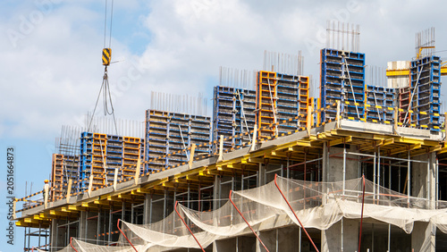 Obraz na plátně Construction site under blue sky with clouds