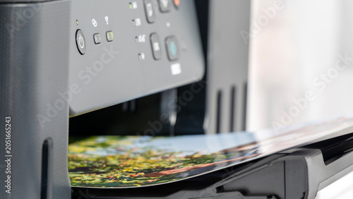 Foto Printer ejects vibrant landscape photo with natural colors and fine detail