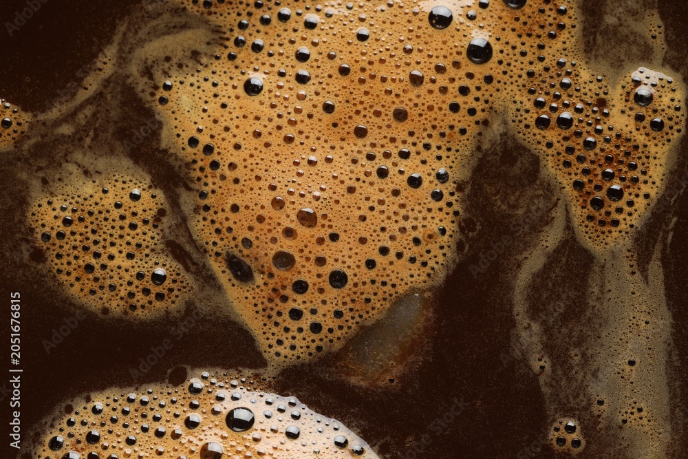 Obraz premium Delicious coffee and bubbles as background, top view