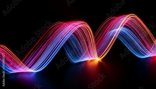 colorful light painting abstract long exposure image with pink blue red and yellow lines on a black background