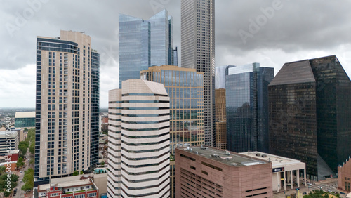 Drone video of downtown Houston Texas office buildings under cloudy sky