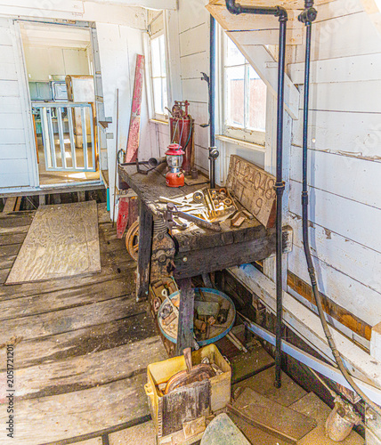 Logsdon Tug Workshop Table with historic knickknacks.