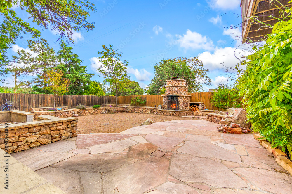 Naklejka premium Stone fireplace outdoor patio