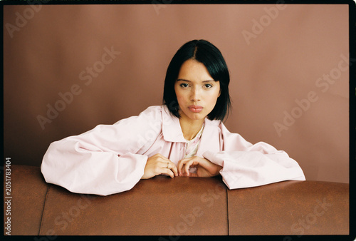 Woman leaning on sofa