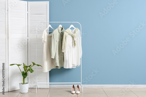 Clothes rack with plant and...