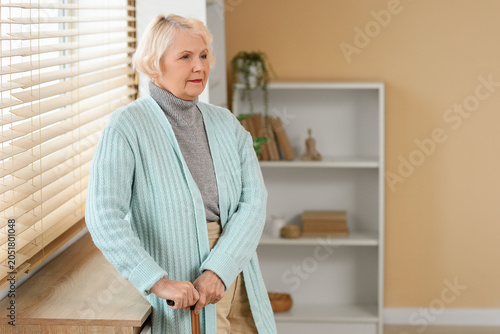 Thoughtful senior woman wit...