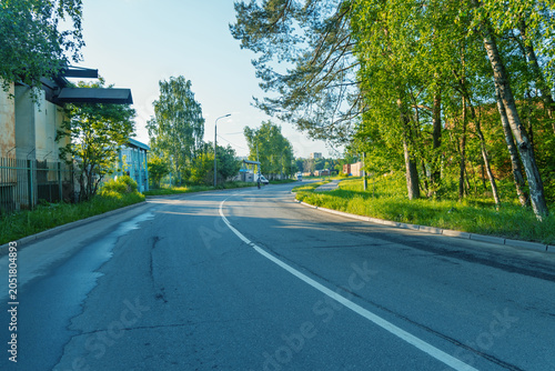 Photography Quiet tree-lined suburban street with morning light